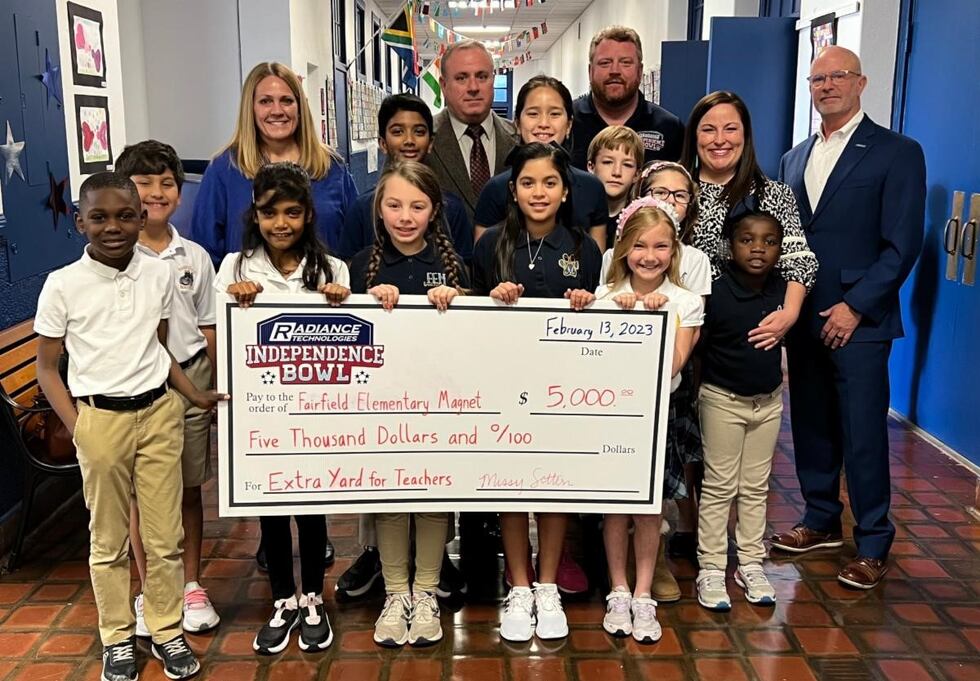 Radiance Technologies presents checks to 2 area schools for